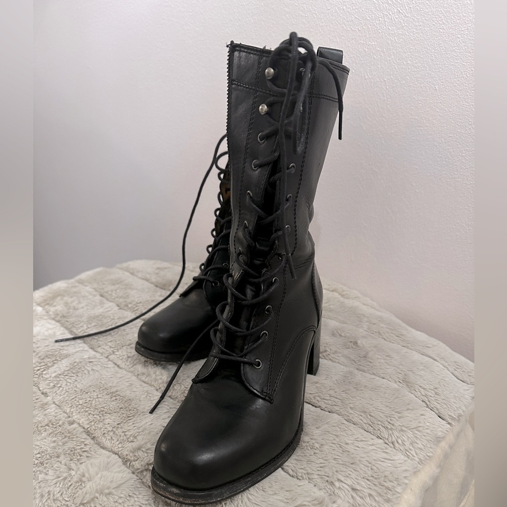Lace up black Frye boots.